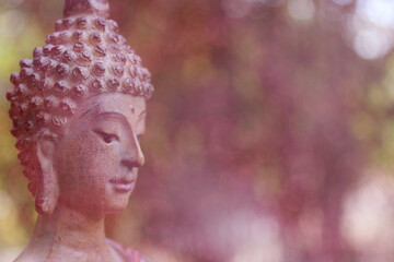 Buddha Statue in Outdoor Garden With Blurred Background