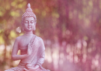 Buddha Statue in Outdoor Garden With Blurred Background