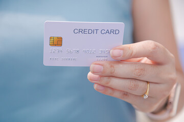 Closeup hand takes of credit card for financial transactions