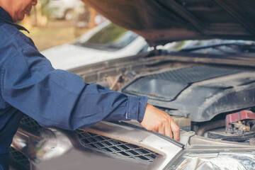 Mechanic car service auto garage in automotive mobile center. Technician workshop repair engine...