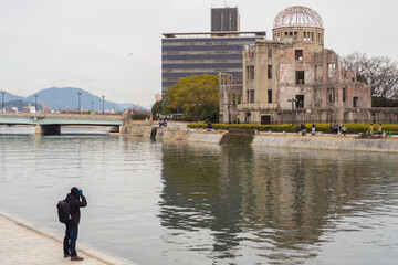 Tourists are amazed at the remains of the buildings left from the violence of the war. That still shows patience and determination in battle