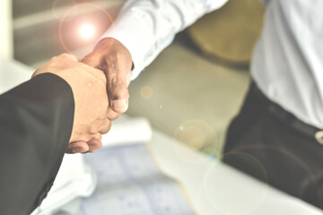 Business partnership meeting concept. Image businessman handshake. Successful businessmen handshaking after good deal. Horizontal. Blurred white background