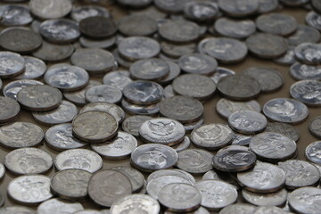 a pile of coins scattered on the floor