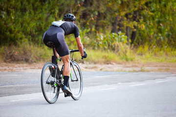 Professional cyclist during the cycling race. Shot in back - Image