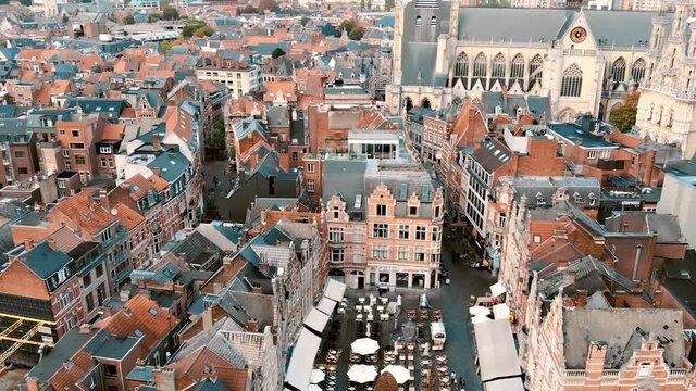 Fly-over Oude Markt Square reveal Saint Peter's Church, Belgium Leuven