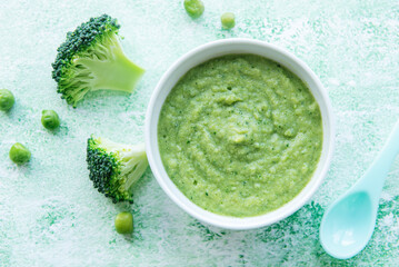 Baby food. Organic green broccoli  puree with ingredients.