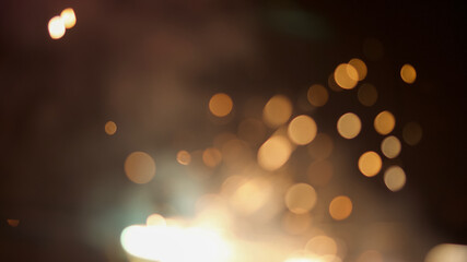 Closeup of romantic burning sparklers on black background.