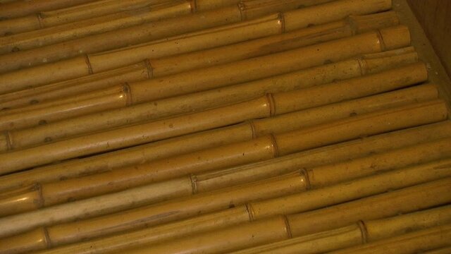 Slow zoom-out on bamboo floor in a Japanese teahouse.