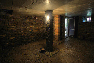 dark basement with stone wall
