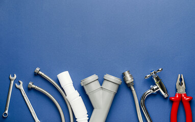 Set of plumber's items on color background