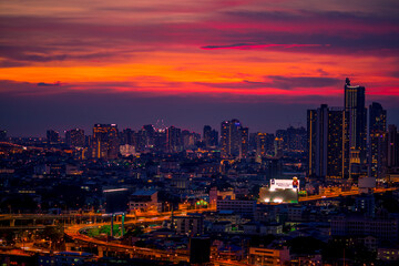Fototapeta na wymiar panoramic high-angle evening background of the city view,with natural beauty and blurred sunsets in the evening and the wind blowing all the time,showing the distribution of city center accommodation
