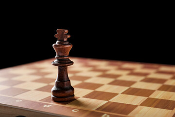 Game board with chess piece on dark background