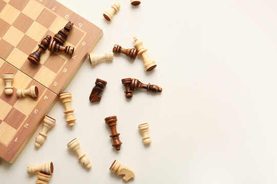 Game board with chess pieces on white background