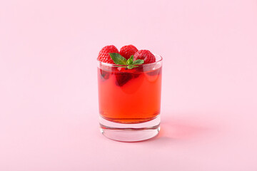 Glass of tasty jelly on color background