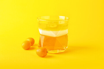 Glass of tasty jelly on color background