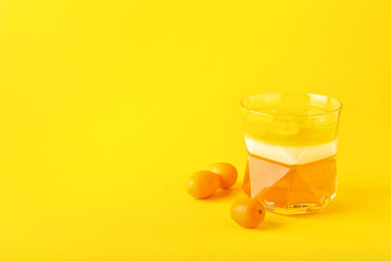 Glass of tasty jelly on color background