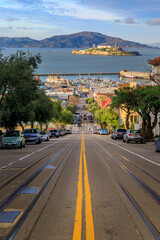 The iconic cable car tracks at the top of Hyde Street, with the famous Alcatraz Island in...