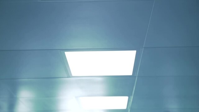 Ceiling with bright lamps in hospital operating room