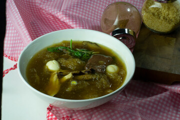 Fish maw is A type of Chinese style dish. Consists of air bags, fish, chicken meat, pork blood, fish maw laying on a red white cloth
