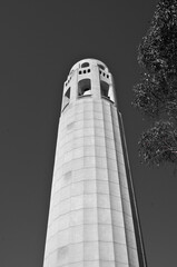 Urban city street scenery with busy avenues, skyscraper skyline, sightseeing landmarks like Coit...