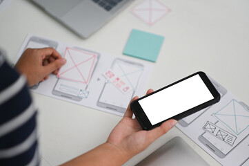 Application designers are designing on smartphone apps, UX, UI concepts.