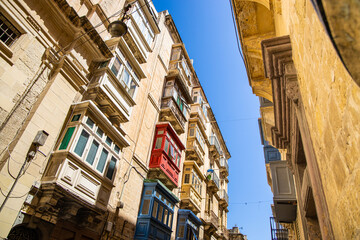 Fototapeta na wymiar Balconies and window boxes on the island of Malta, Europe