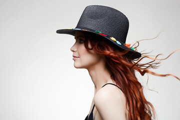 beautiful happy woman in Hat, with curly long red hair