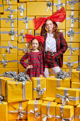 Friendly Charming Lady With Kid Girl In Colourful Party Wear Posing At Camera, Among Many Gifts, Celebrating Holiday Together, Have Fun, Smile