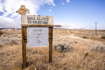 Desert Road Private Property Sign Area Closed to Shooting Dirt Road