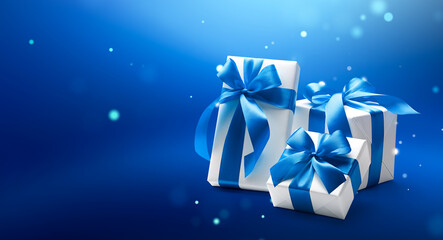 White gift boxes over blue abstract background with copy space