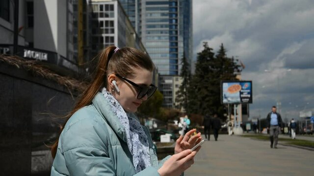 Close up portrait of texting woman on a smartphone device