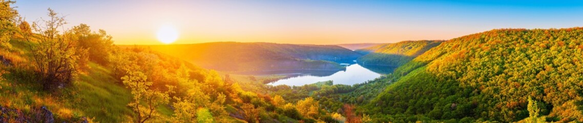 Vivid sunrise landscape in the national nature park Podilski Tovtry, canyon and Studenytsia river is tributary of Dnister river, view from above