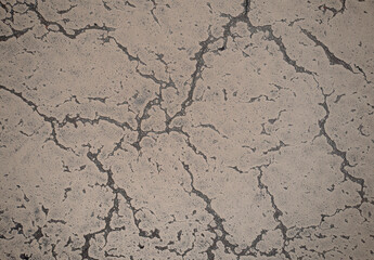 Grunge cracked texture of an old floor. Background of damaged stone