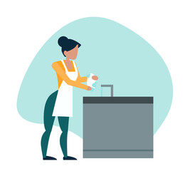 woman is doing dishes in the kitchen