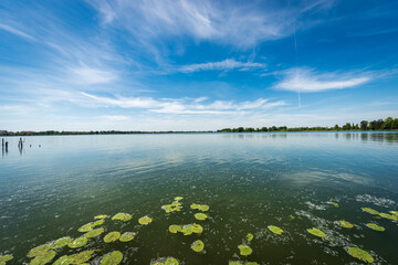 The Lower Lake of Mantua (Lago Inferiore) or Mincio River in front of the public park in springtime. Mantova, Lombardy, Italy, southern Europe.