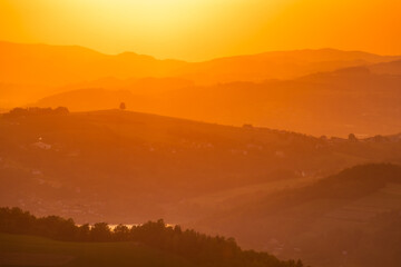 Obraz premium A warm summer sunset in the Rożnowskie Foothills, near Nowy Sącz. Poland, Lesser Poland Voivodeship.