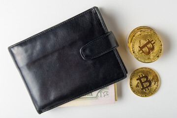 Black leather wallet, USD banknote and golden bitcoin. Virtual cryptocurrency and money concept