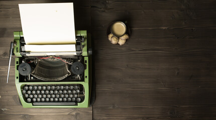 old typewriter with blank paper and coffee 