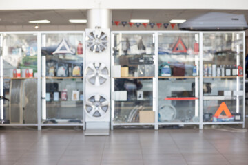 Autoshop. Original spare parts and accessories for modern cars. Themed blur background.
