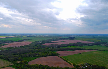 View from the sky to the summer landscape with fields and sky for background