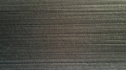 Plowed field from above. Preparation for sowing. Agricultural background