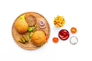 Homemade burgers on serving board. Fastfood meal background