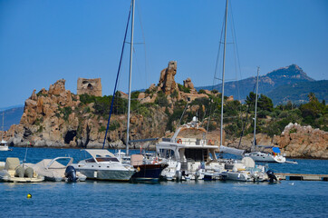 Fototapeta na wymiar Small port (Porto di Presidiana) of the coastal town Cefalu in Sicily, view to ancient ruins on a rock