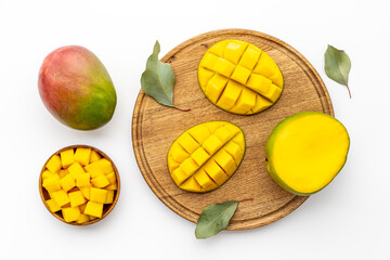 Mango fruit and mango cubes in bowl. Fruits background