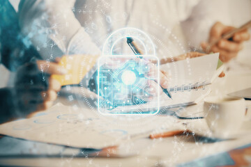 Double exposure of lock drawing over people taking notes background. Concept of security