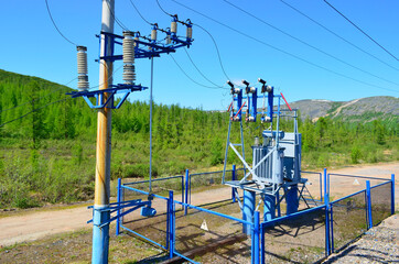 Fototapeta na wymiar substation transformer in mountains