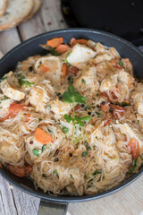 Rice pasta with vegetables and meat.