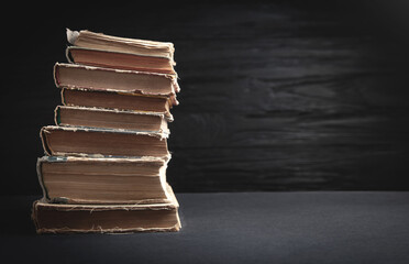 Old books on the black background.