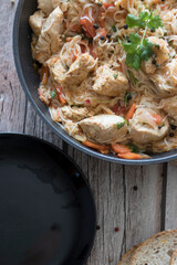 Rice pasta with vegetables and meat.