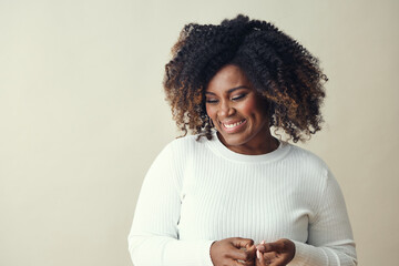 Smiling Woman With curly hair Highlights Looking Down